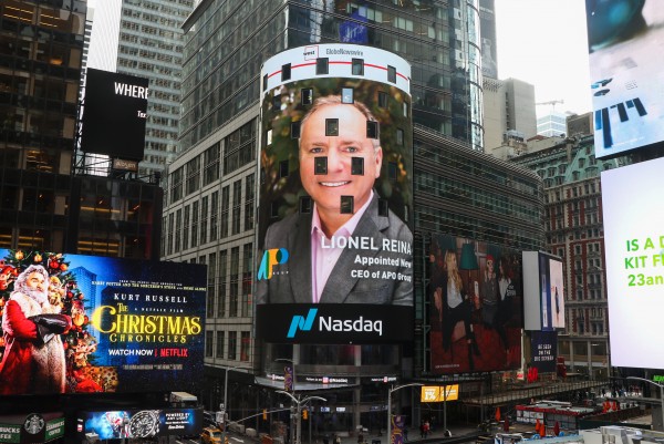 A picture of APO Group new CEO, Lionel Reina, displayed on the NASDAQ Tower in New York's Time Square