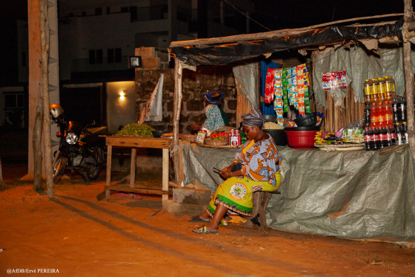 “Light drives development!”: Electricity supply to Sèmè-Kpodji in Benin means Fatima Hounkanrin can keep her shop open till late at night